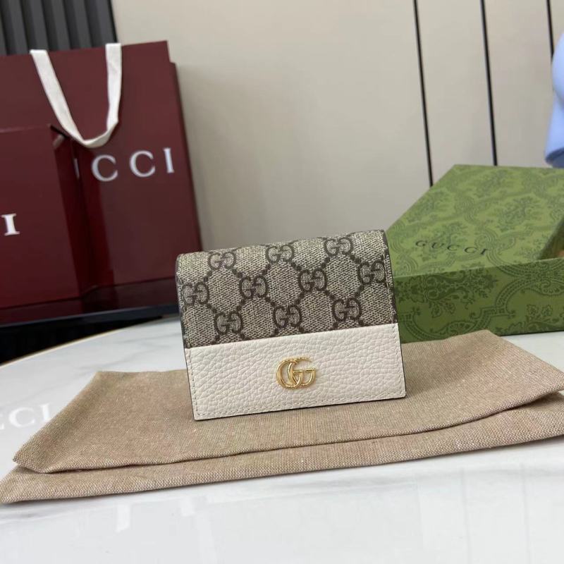 Кошелёк Gucci с монограммой и логотипом GG