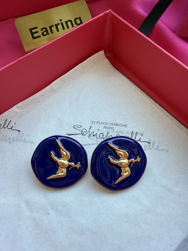 Серьги Schiaparelli с золотым орлом на синем фоне