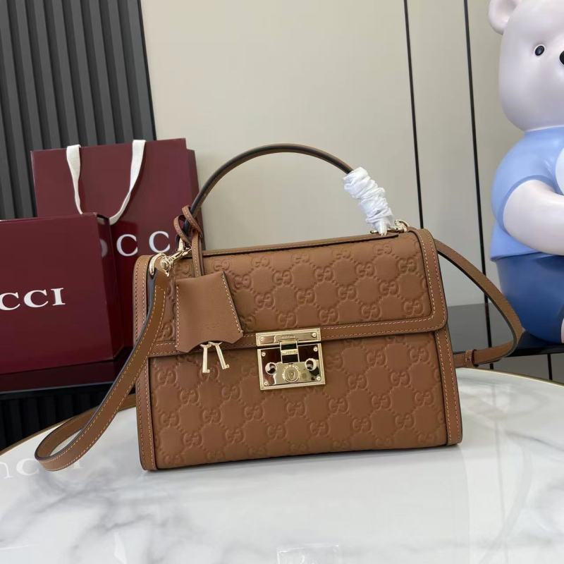 Женская сумка Gucci с замком и логотипом