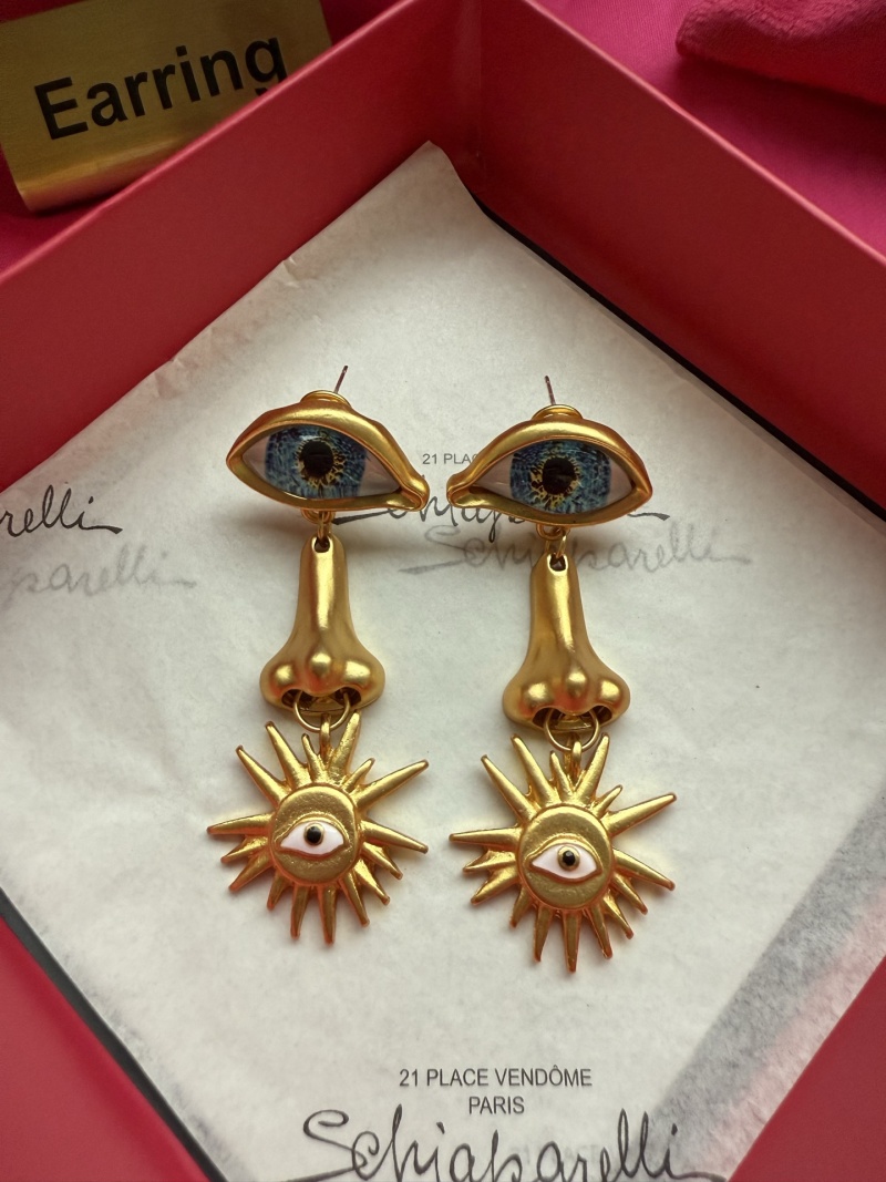 Серьги Schiaparelli с глазами и солнцем