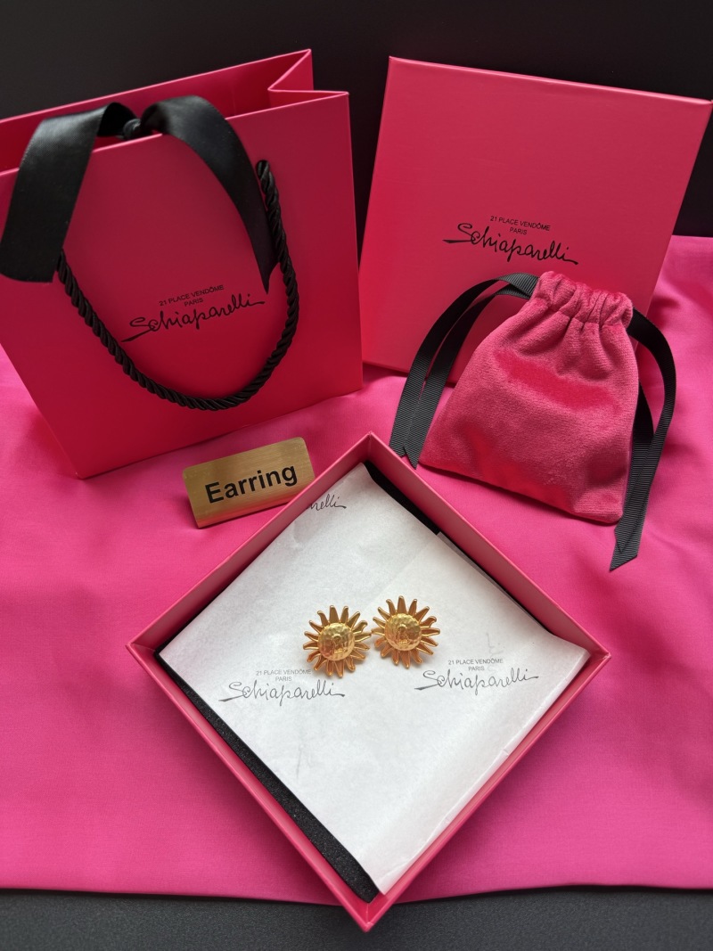 Серьги-солнце с ключом Schiaparelli
