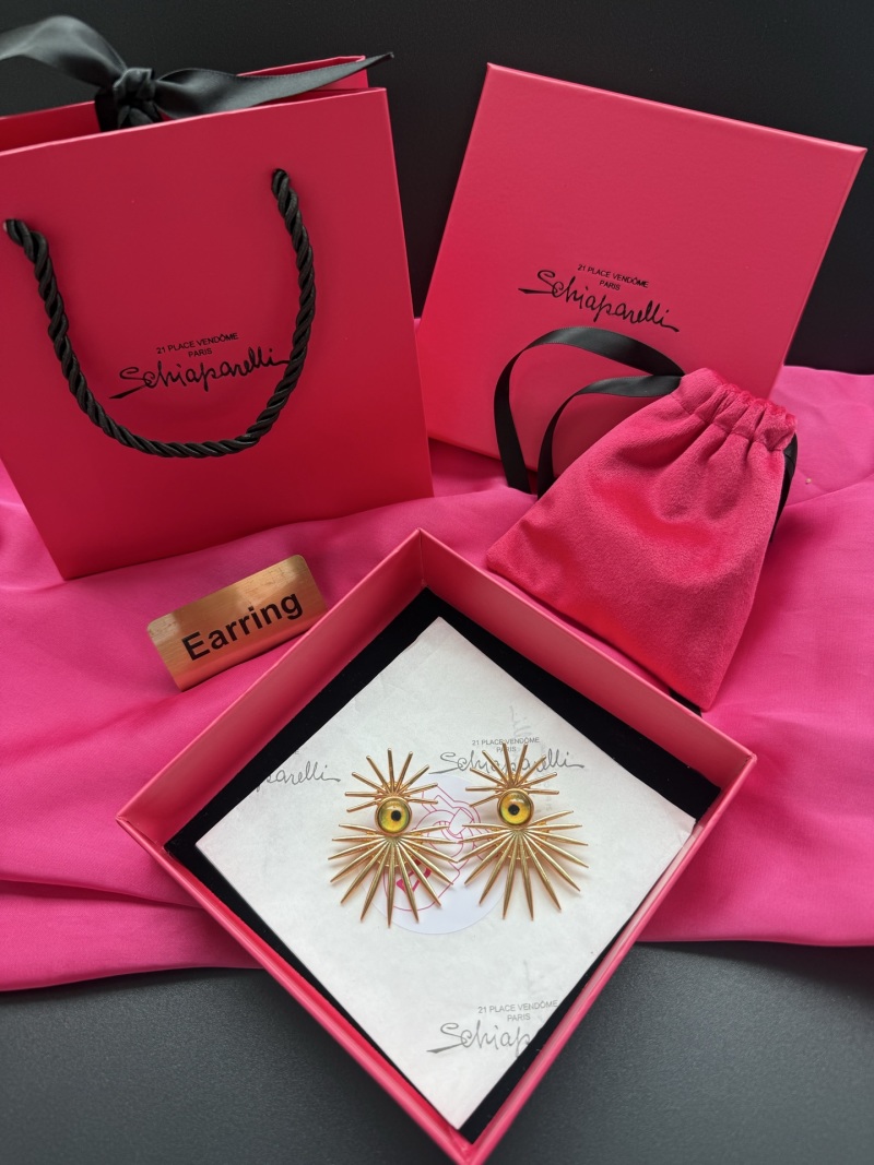 Серьги Schiaparelli с золотистым металлом и желтыми стеклянными глазами