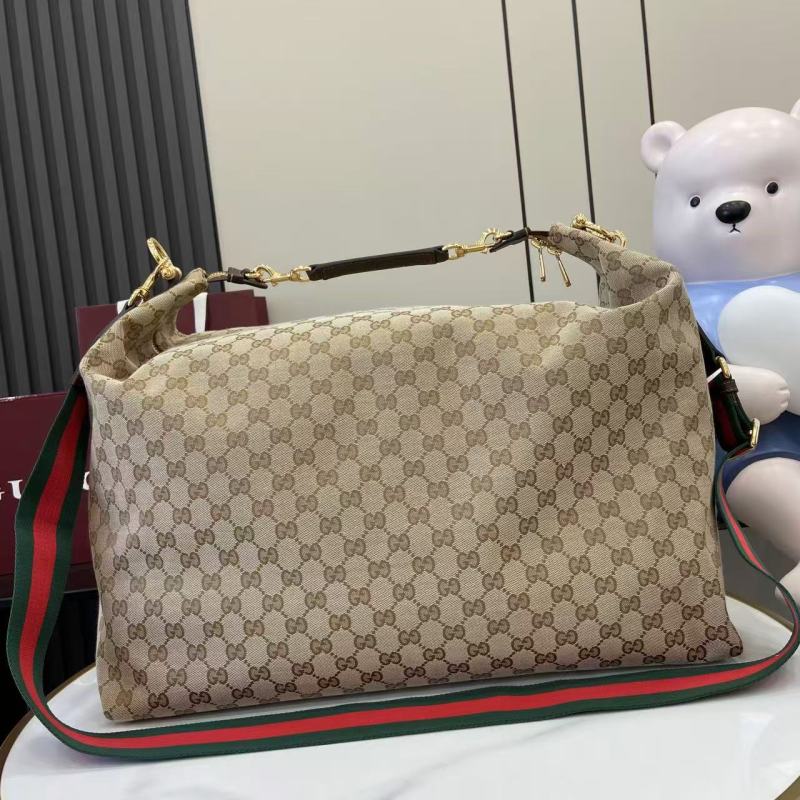 Сумка Gucci с монограммой и ручкой