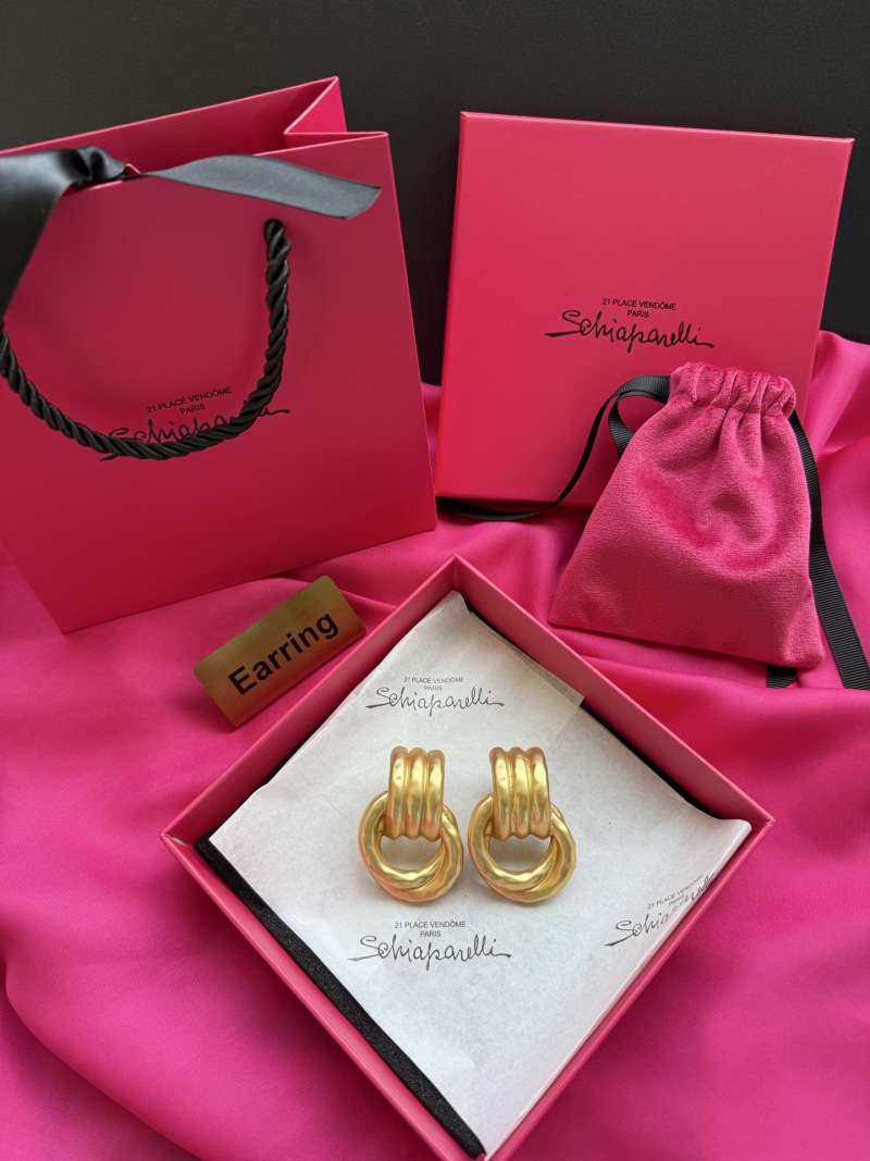 Золотистые серьги с узлом Schiaparelli