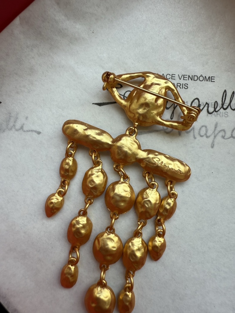 Брошь Schiaparelli
