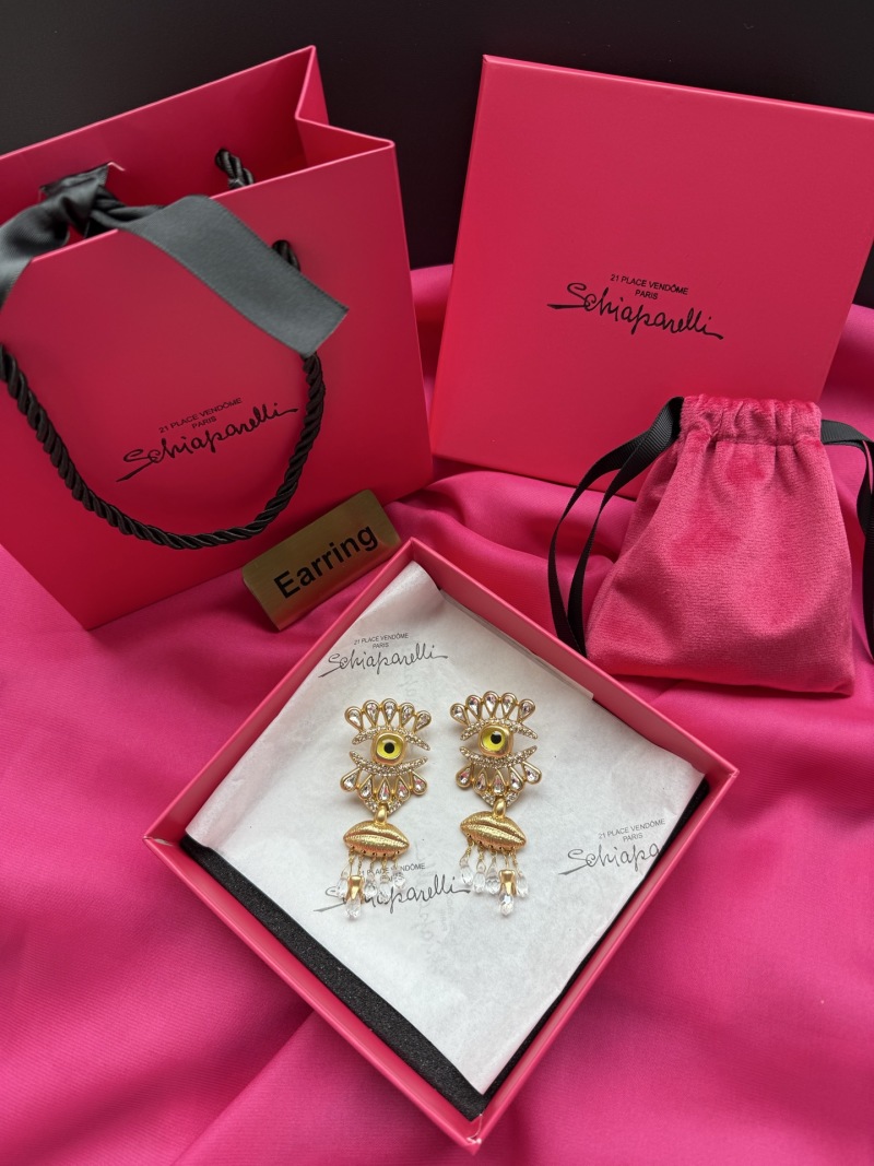 Серьги Schiaparelli с глазом и кисточками