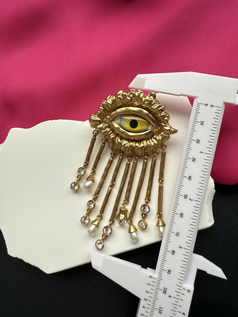 Серьги с глазом и кисточками Schiaparelli