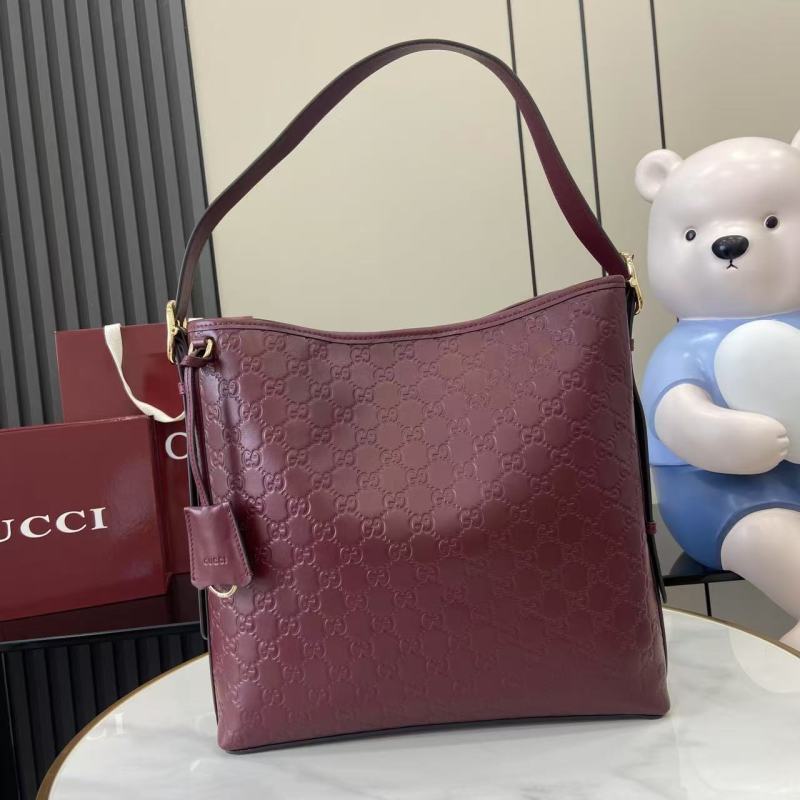 Сумка Gucci бордовая с тиснением