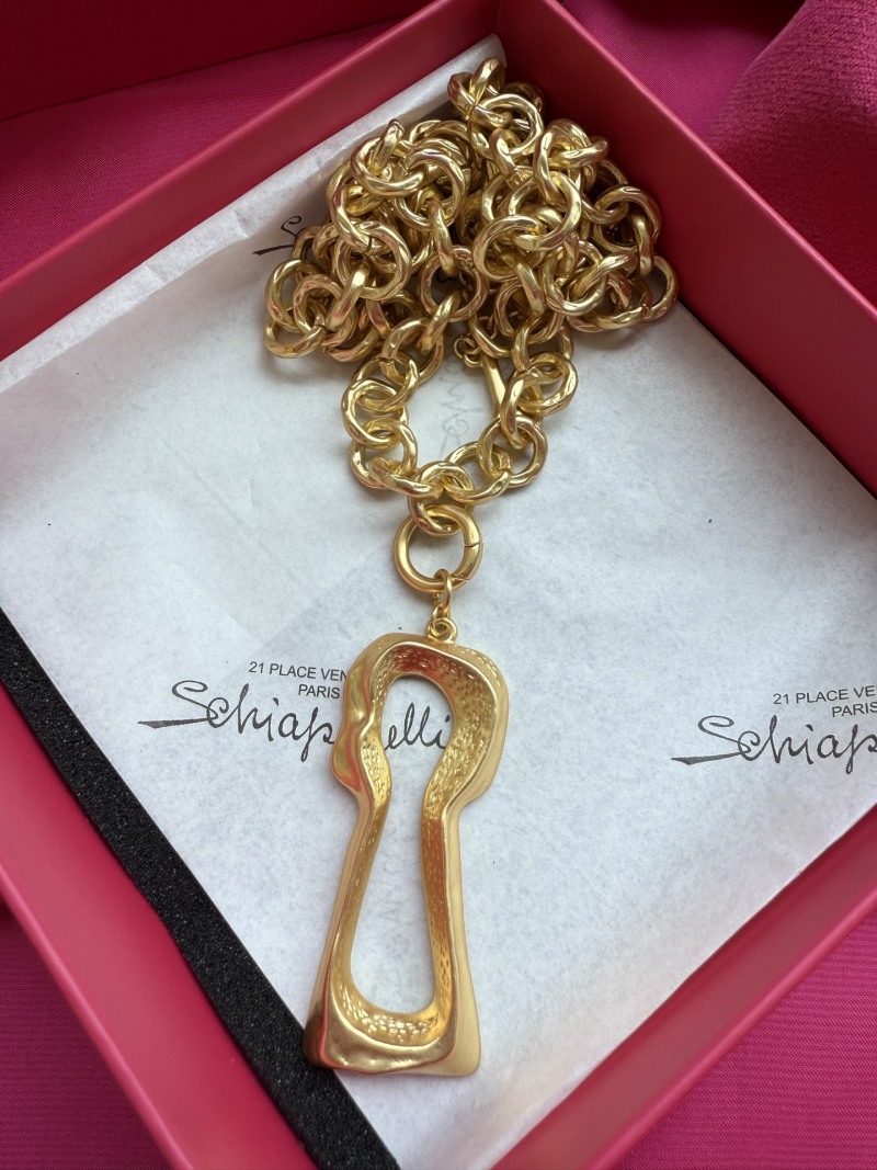 Золотистое колье с подвеской в виде ключа Schiaparelli