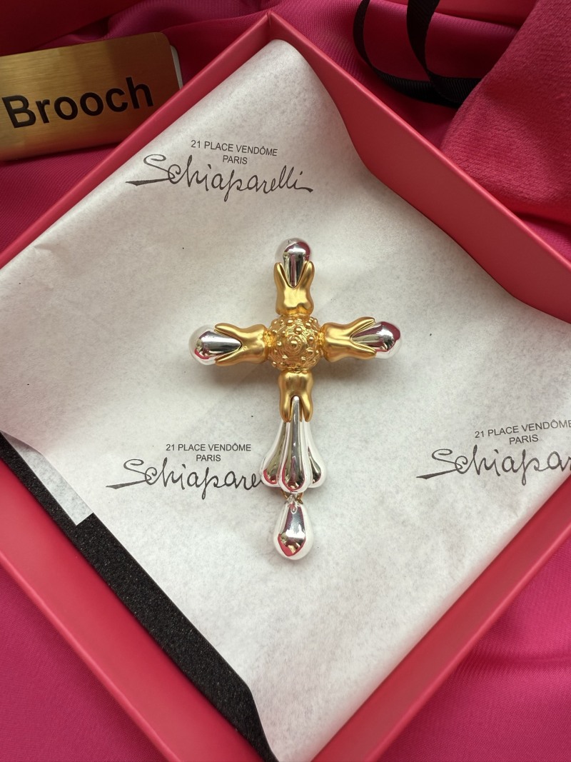 Брошь Schiaparelli в форме креста