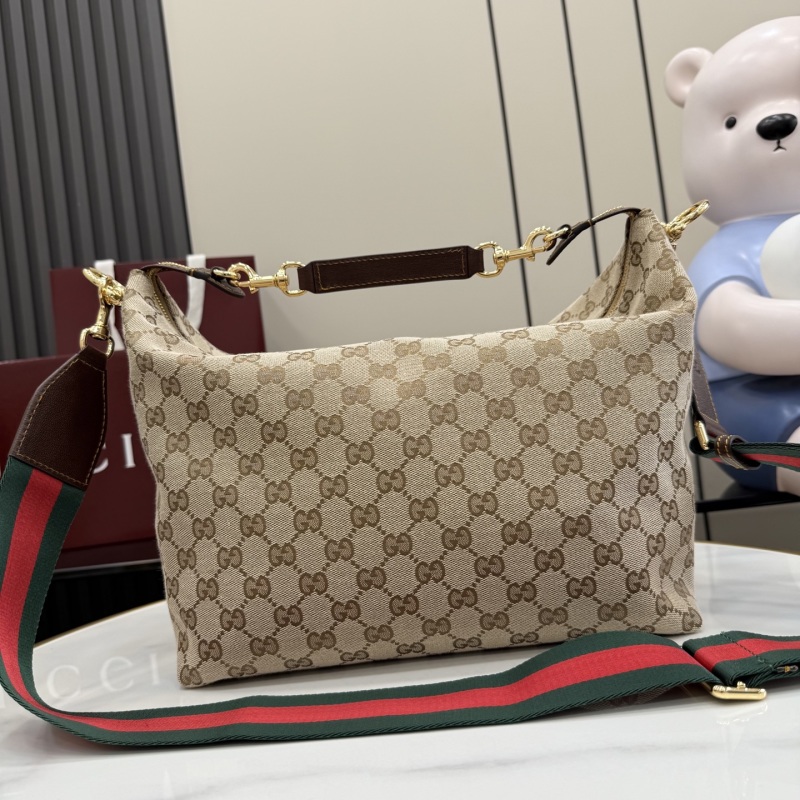 Сумка Gucci с канвой и кожаной ручкой