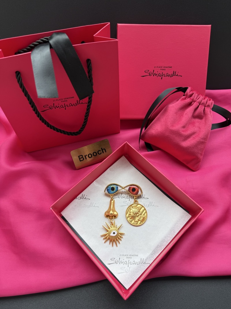 Брошь Schiaparelli с глазами и солнцем
