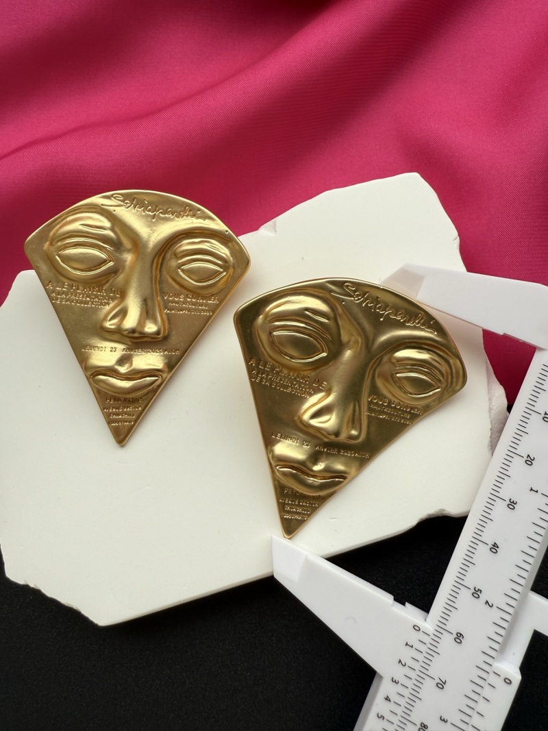 Серьги в форме лица Schiaparelli