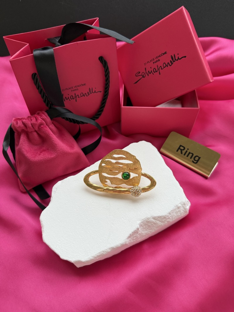 Золотистое кольцо с зелёным кристаллом Schiaparelli