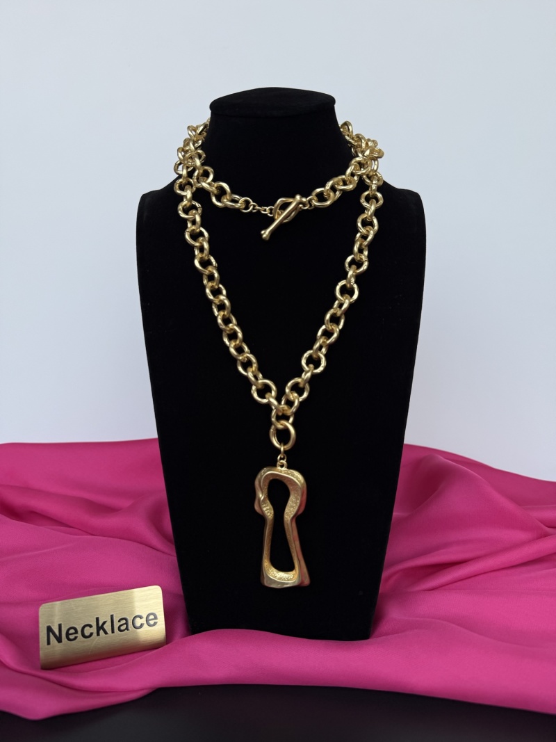 Золотистое колье с подвеской в виде ключа Schiaparelli