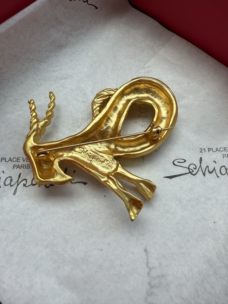 Брошь Schiaparelli