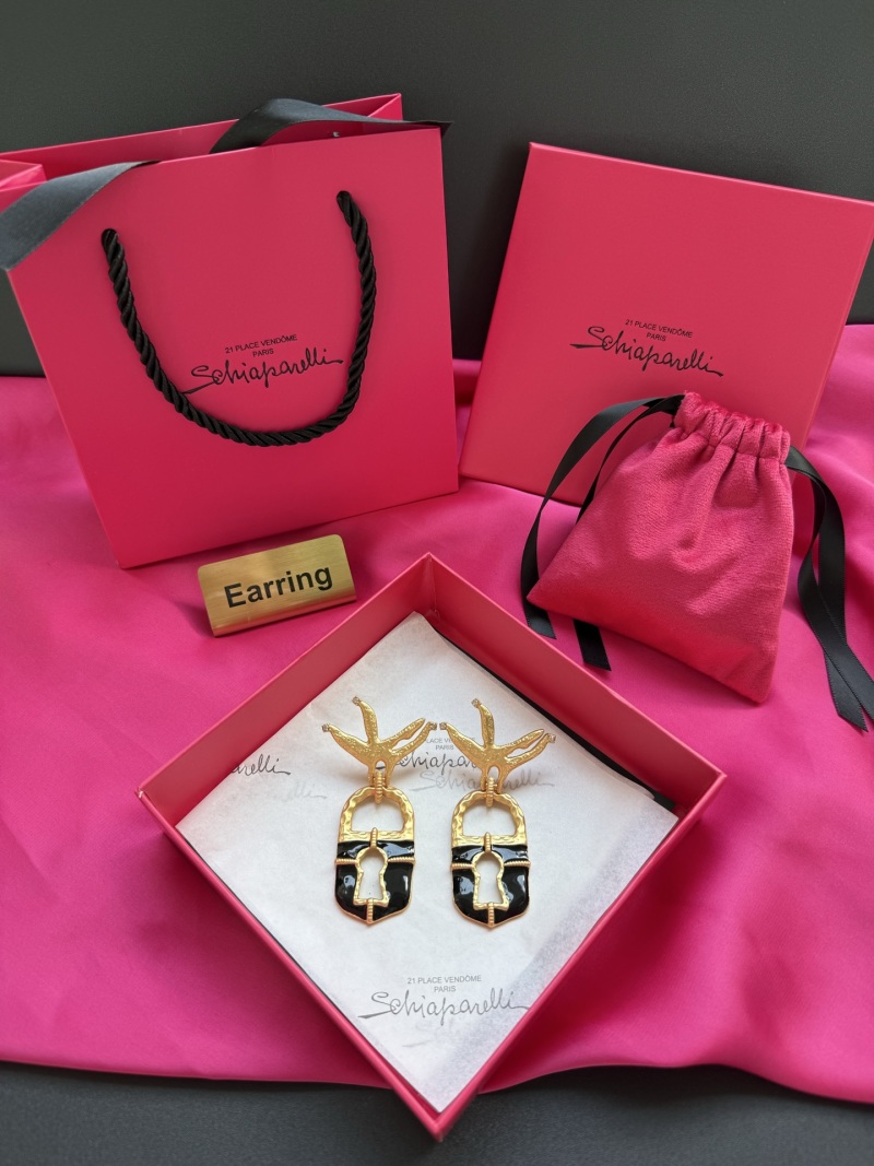 Серьги Schiaparelli в виде птиц с ключом