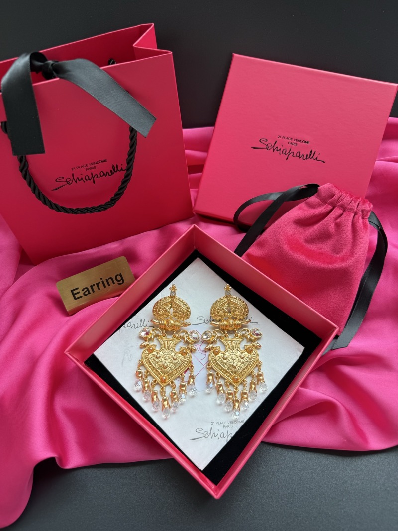 Золотистые серьги с кристаллами Schiaparelli