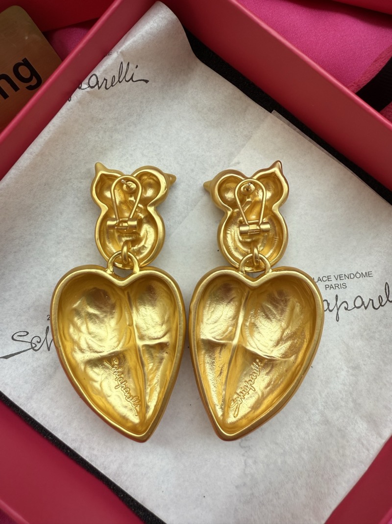 Золотистые серьги в форме сердец Schiaparelli