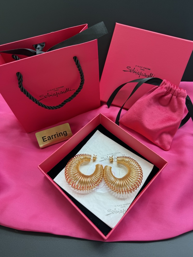 Золотистые серьги-кольца с витой конструкцией Schiaparelli