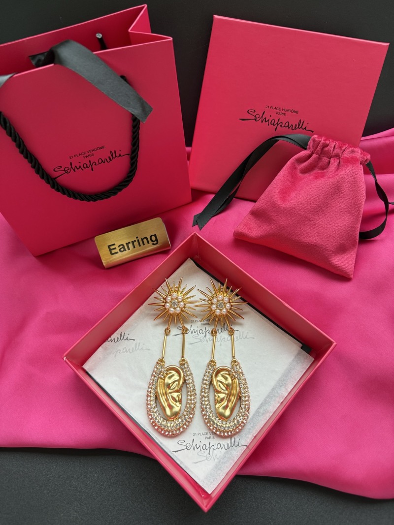 Серьги Schiaparelli в форме уха с кристаллами