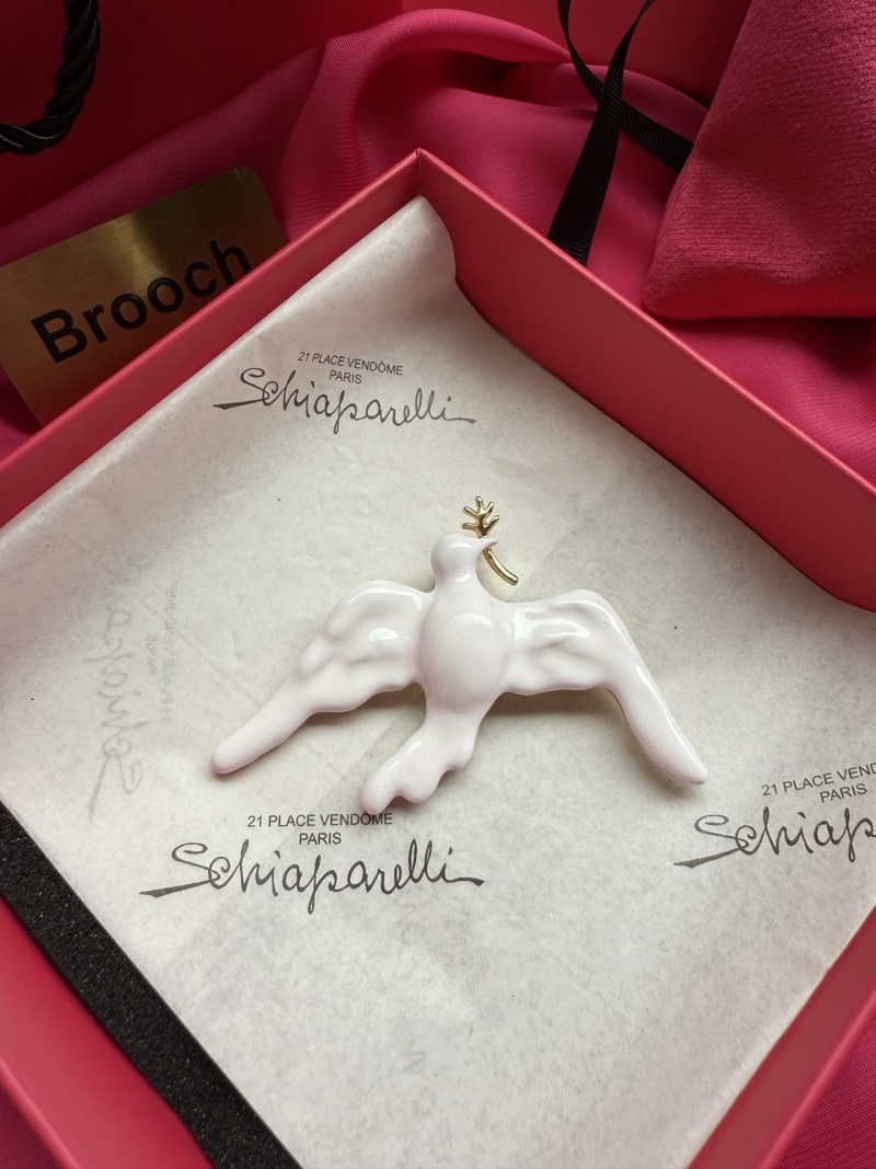 Брошь Schiaparelli