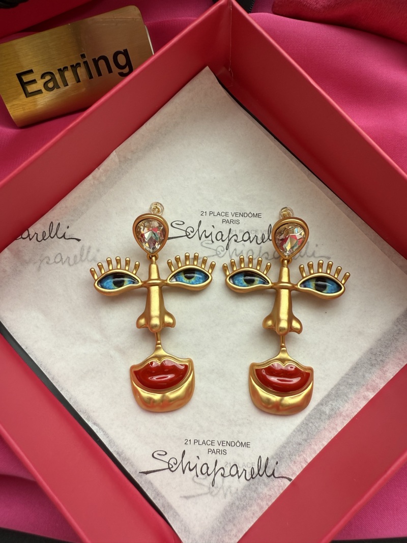 Серьги Schiaparelli с глазами и губами