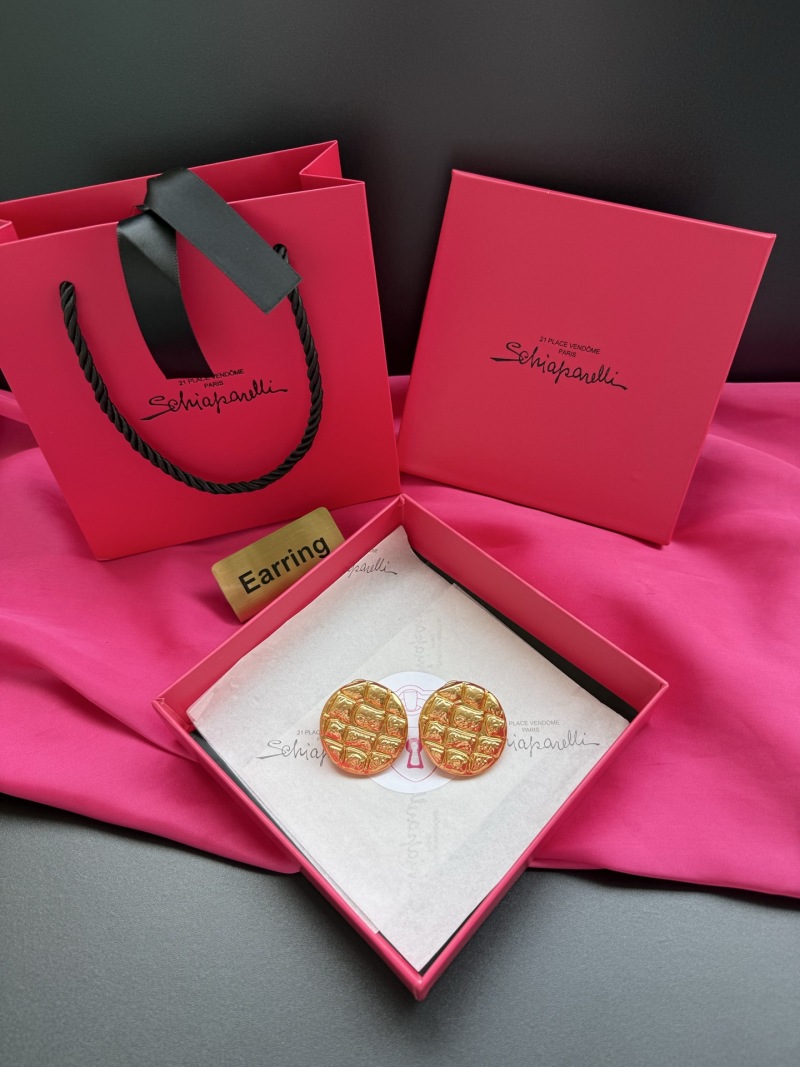 Золотистые серьги с рельефным узором Schiaparelli