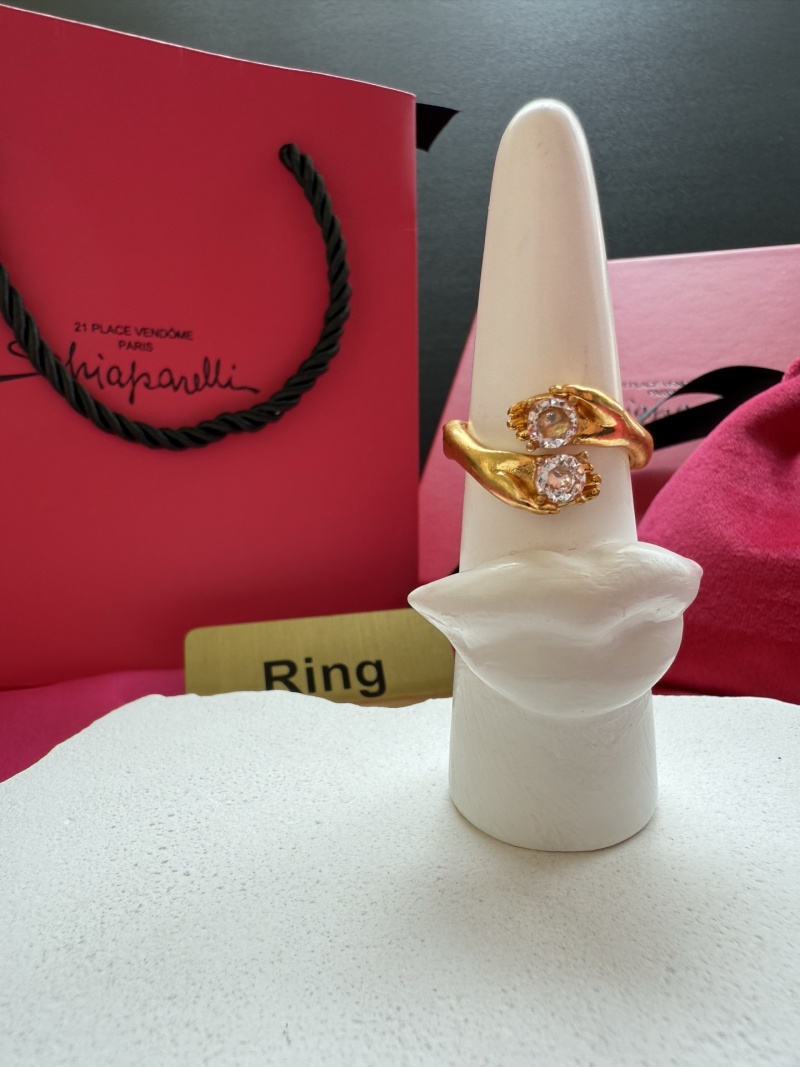 Золотистое кольцо с камнями Schiaparelli