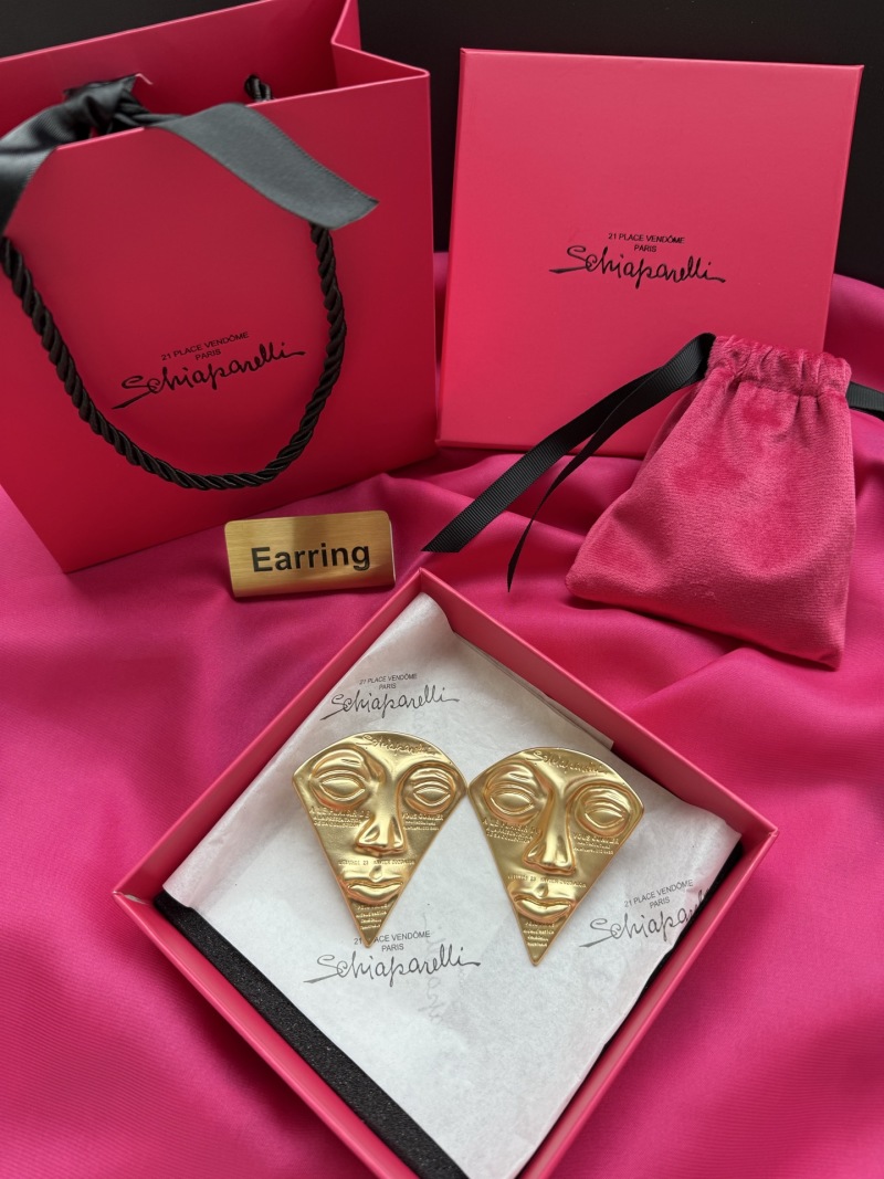 Серьги в форме лица Schiaparelli
