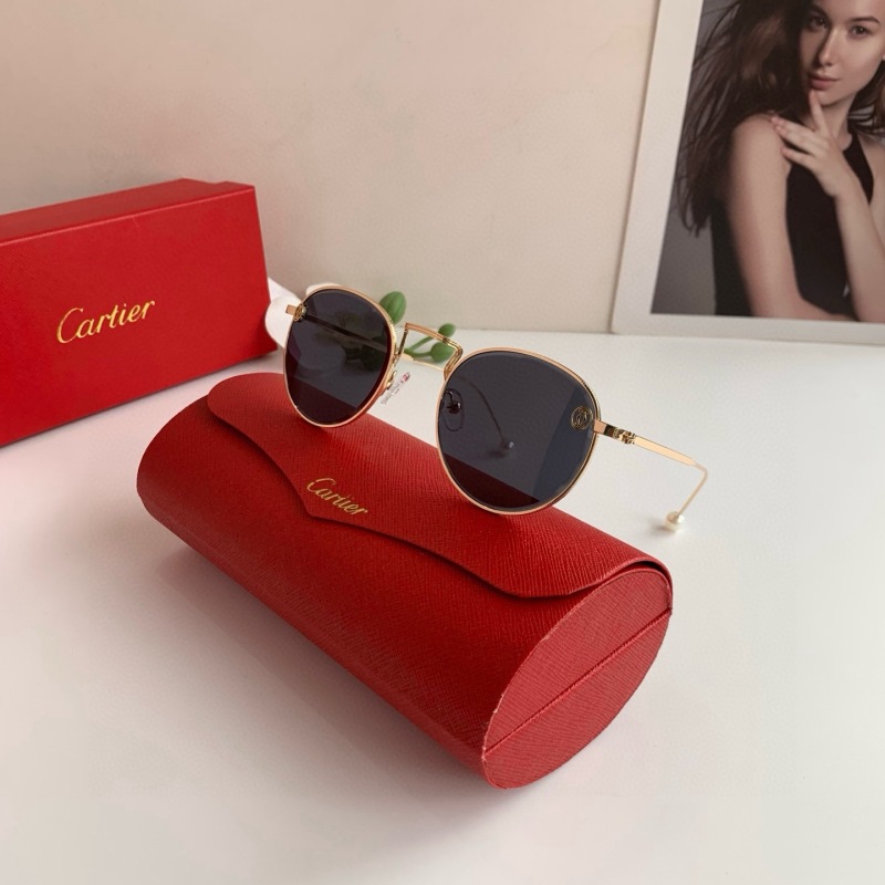 Круглые солнечные очки Cartier в золотой оправе