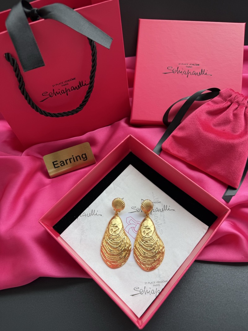 Золотистые серьги в форме мидии Schiaparelli