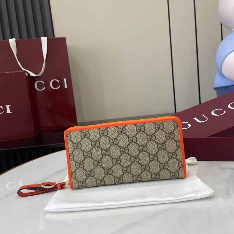 Кошелёк Gucci с монограммой и оранжевой окантовкой