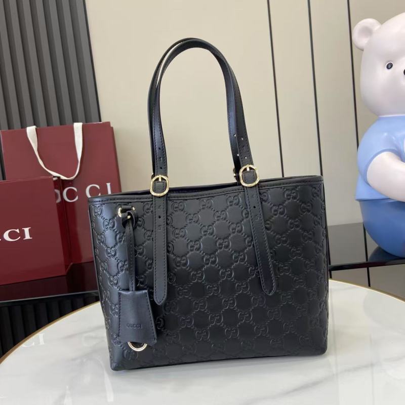 Черная кожаная сумка-тоут Gucci с тиснением
