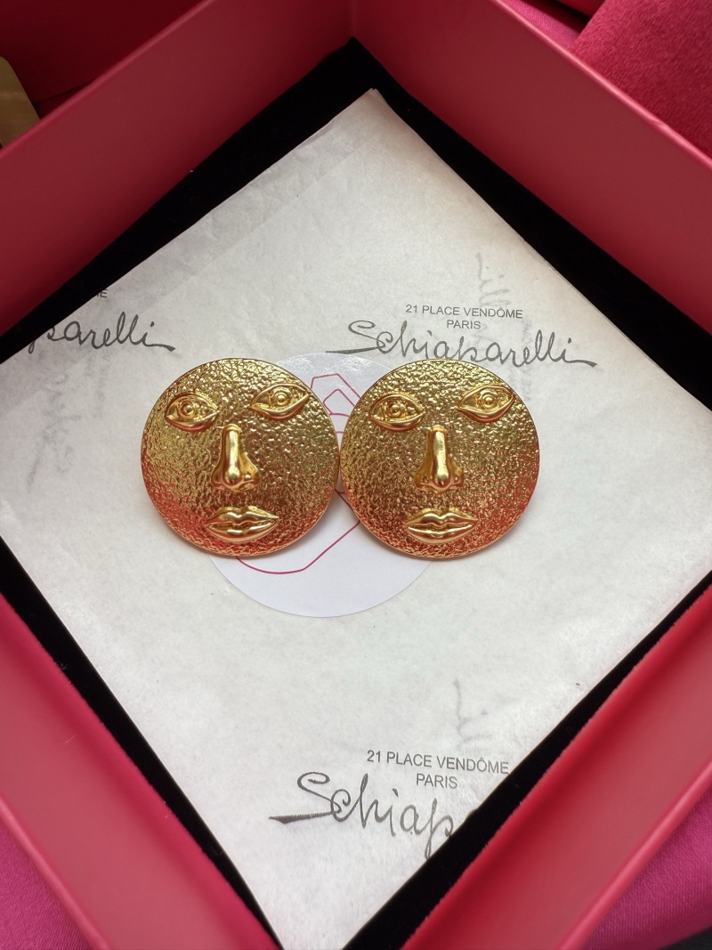 Серьги в виде лиц с золотым отливом Schiaparelli