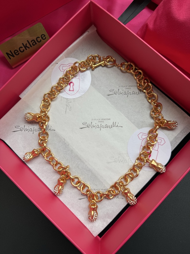 Золотистое колье с подвесками Schiaparelli