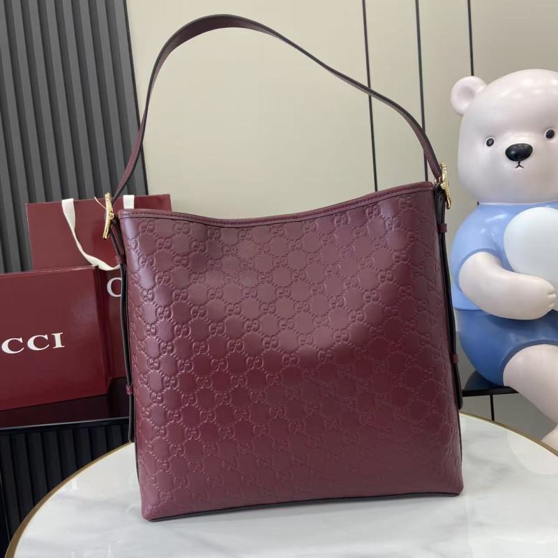 Сумка Gucci бордовая с тиснением