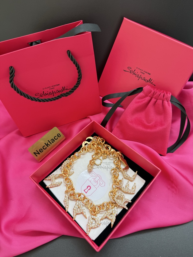 Наручное колье с кристаллами и надписью Schiaparelli