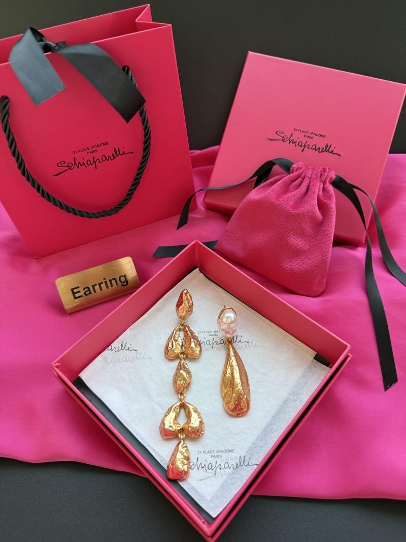 Золотистые серьги Schiaparelli