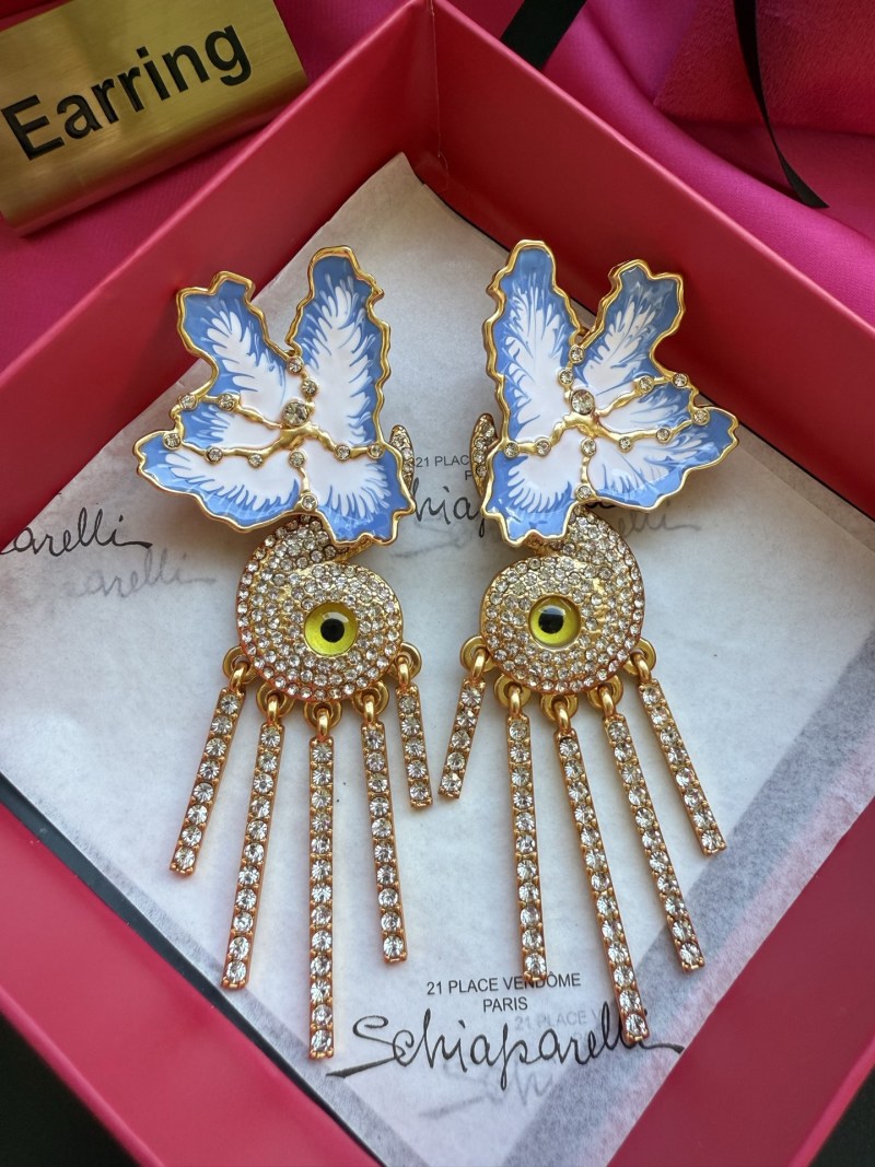 Серьги Schiaparelli с глазом и перьями