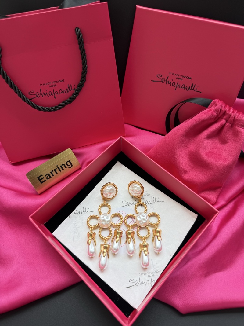 Серьги Schiaparelli с жемчугом и золотыми деталями