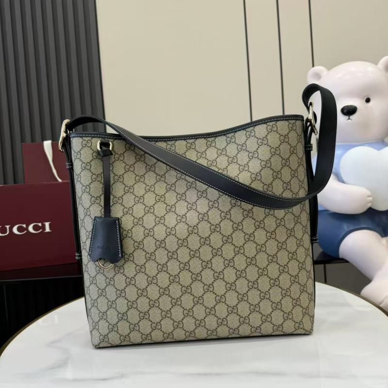 Сумка Gucci с монограммой и кожаной отделкой