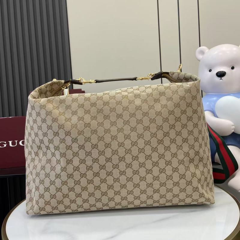 Сумка Gucci с монограммой и ручкой