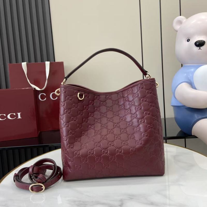 Сумка Gucci бордовая с тиснением