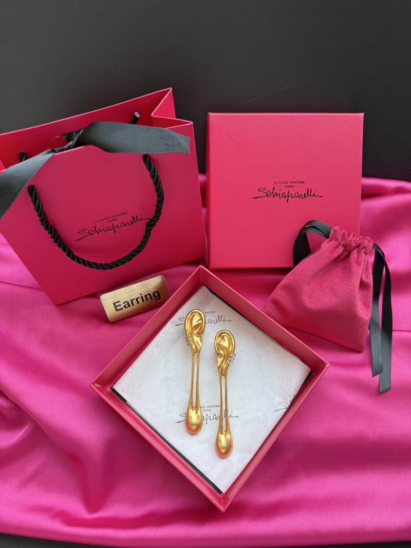 Золотистые серьги в форме уха Schiaparelli