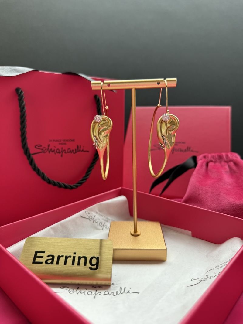 Серьги в форме уха с камнями Schiaparelli