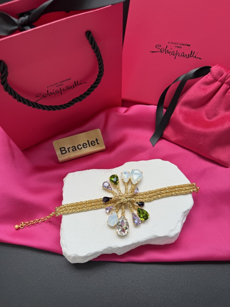 Браслет с кристаллами и золотистой нитью Schiaparelli