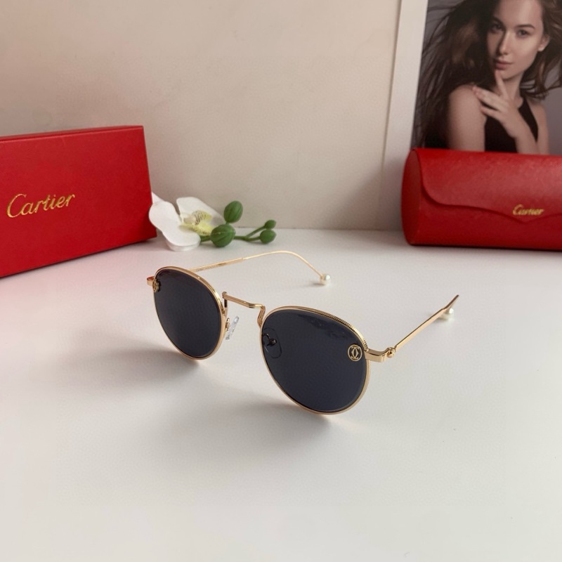 Круглые солнечные очки Cartier в золотой оправе