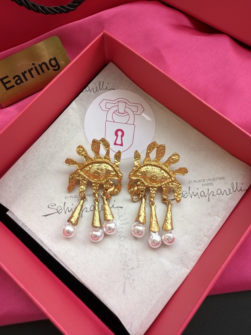 Серьги Schiaparelli в виде глаз с жемчугом