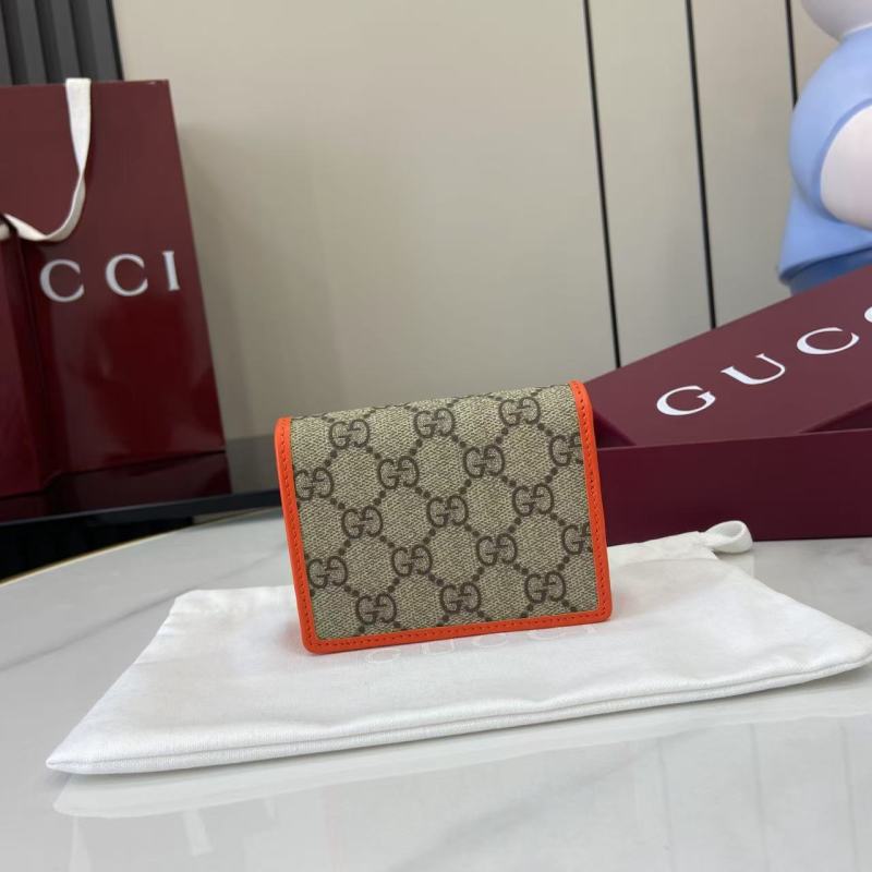 Портмоне Gucci с монограммой и оранжевой отделкой